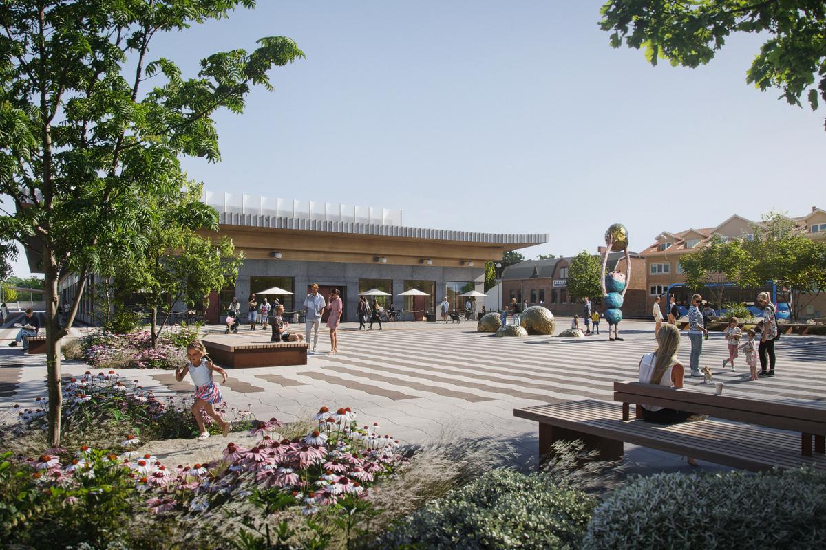 Södra stationstorget med konstverket Horisonten - att ta emot en sol, träd, bänkar och stationen i bakgrunden. 